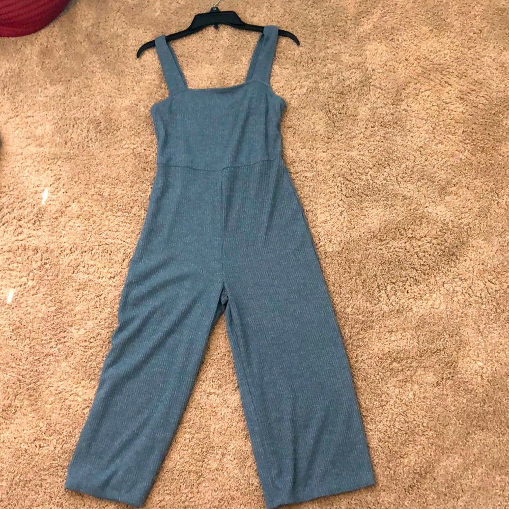 Blue-gray jumpsuit.
